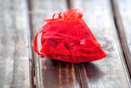 red bag on woodの写真素材