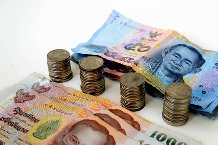 Few coins and banknotes of Thailand Kingdom (Thai Baht, THB)の写真素材