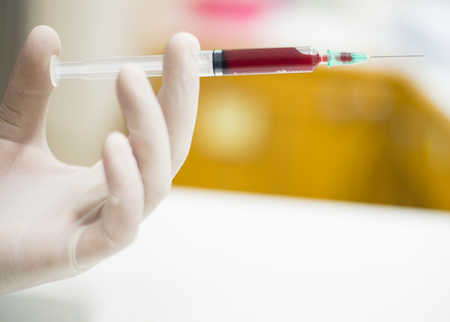 blood leaking from a syringeの写真素材