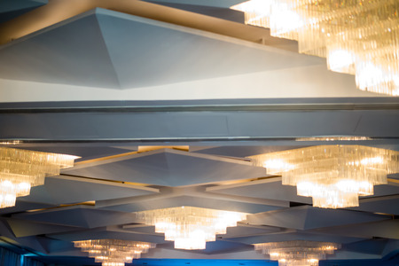 Warm lighting coming out from beautiful lamps on ceiling