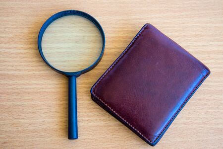 Magnifying Glass in wallet conceptの写真素材
