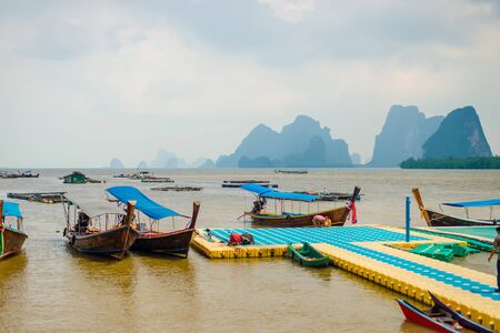 Dusk in the Koh Panyi Muslim fishing village in the Pang Nga bay, Thailandの写真素材