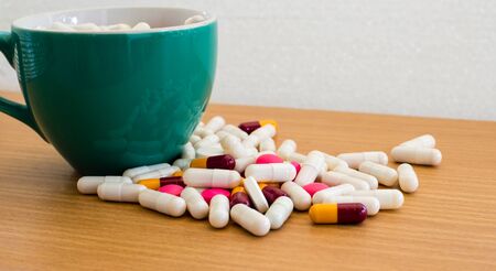 pills in green cup.の写真素材