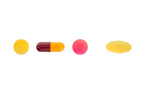 Many colorful pills isolated on white