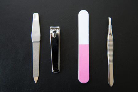 Top view of manicure equipment isolated on black.の写真素材