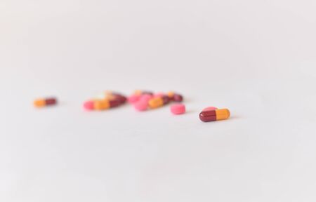 Many pills and tablets isolated on white backgroundの写真素材