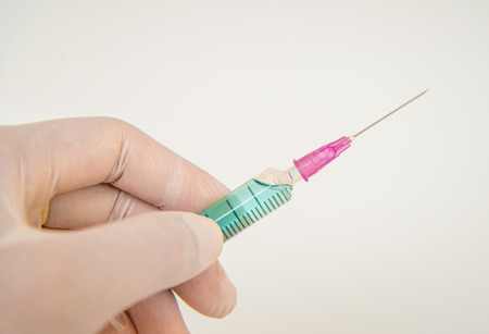 Syringe, medical injection in handの写真素材