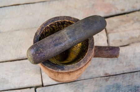 mortar on wood backgroundの写真素材