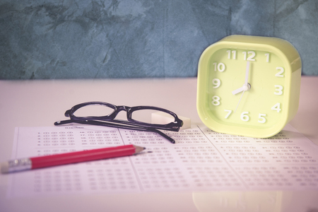 Glass with clock in exam conceptの写真素材