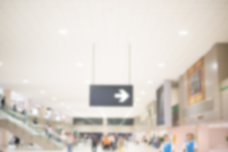 Exit Sign on blurred people.の写真素材