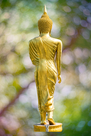 buddha statue on blur bokeh background.の写真素材