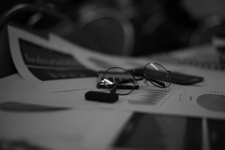 Blurred business work space in dark tone.の写真素材