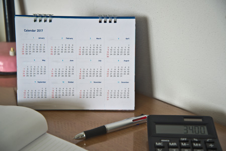 Blurred calendar page in work space.の写真素材