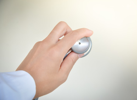 Stethoscope in hand Doctor.の写真素材