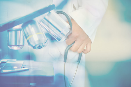 Double exposure scientist with microscope.