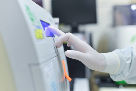 Hand scientist working in laboratory.の写真素材