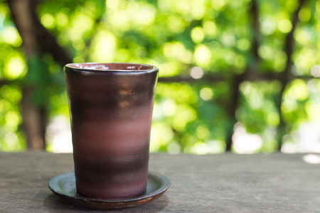 Cup on green bokeh background.の写真素材