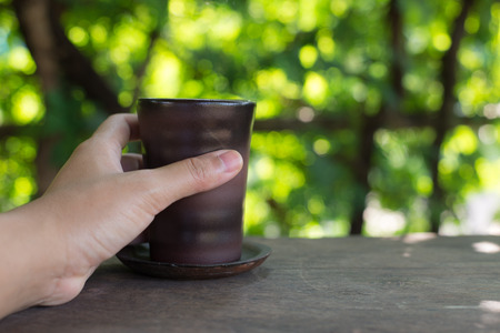 Cup on wood background.の写真素材