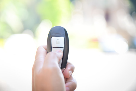 Key car in hand on blurred background.の写真素材