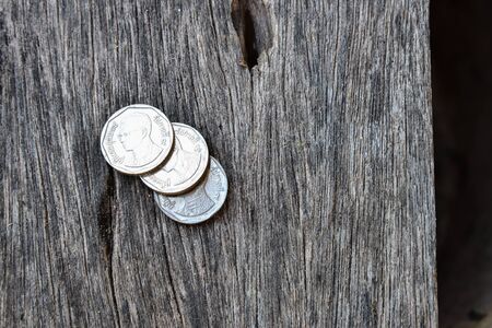 Thai coins on wood textureの写真素材