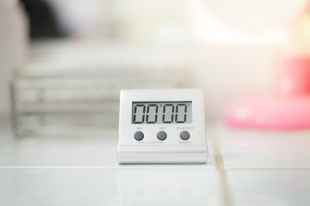 Timer in laboratoey over white tone.の写真素材