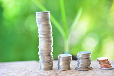 Saving money on green background.
