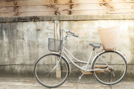 old bike on vintage wallの写真素材
