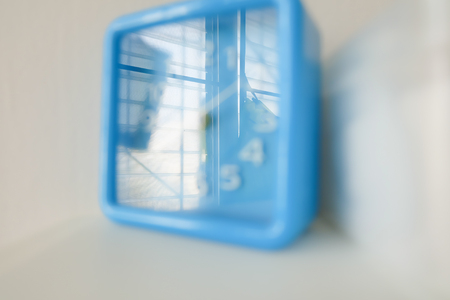 Blue clock in white tone.