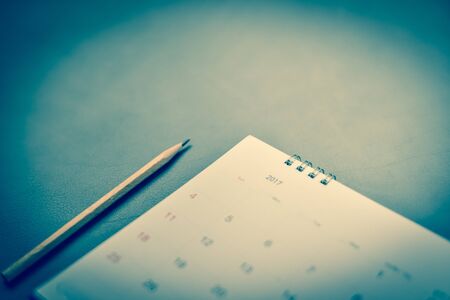 blurred calendar in planning concept on leather texture.の写真素材