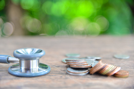 coin with stethoscope in health concept.の写真素材