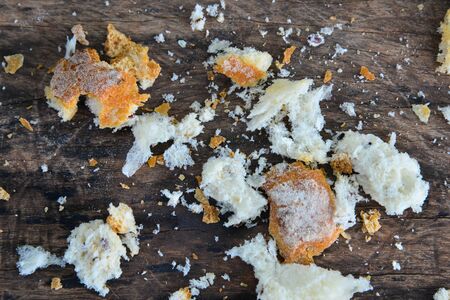 bread on wood textureの写真素材