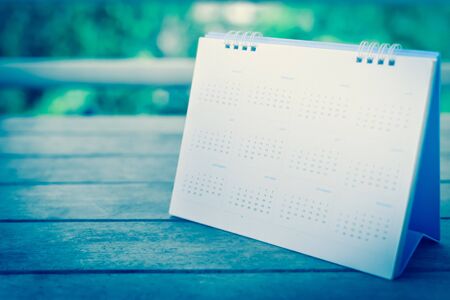 Blurred calendar on wood texture