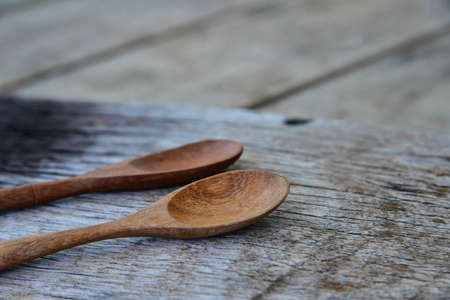 Spoon wood on wood texture.の写真素材