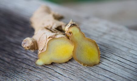Ginger on wood textureの写真素材