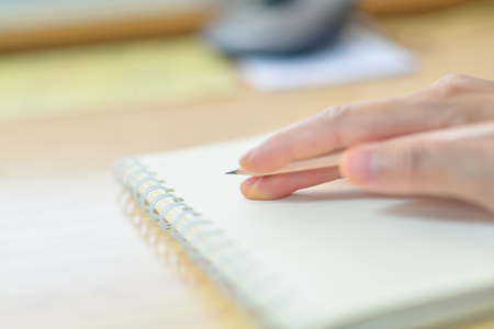 Blurred hand writing on notebook in clear tone.の写真素材