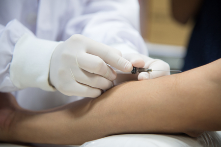 Diabetes patient healthcare with scientist in white tone.の写真素材