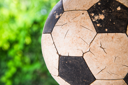 Close up Old football on green nature background.の写真素材