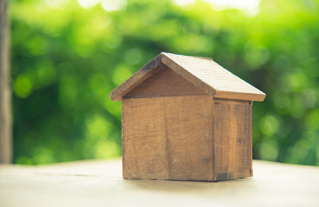 Wooden house on green nature background.の写真素材