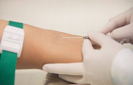 Closup on hand scientist working with patient.の写真素材