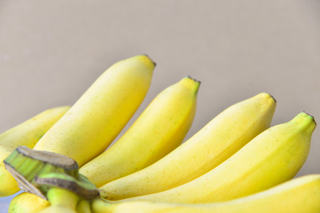 Close up fresh bananas on wooden background.の写真素材