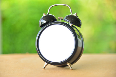 Close up vintage clock on blur background.