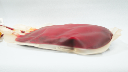 Close up on red blood bag in laboratory.の写真素材