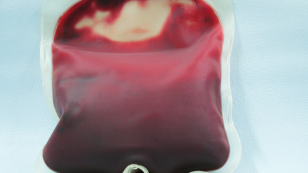 Close up on red blood bag in laboratory.の写真素材