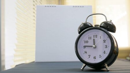 Close up vintage clock on blur background.