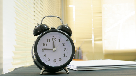 Close up vintage clock on blur background.の写真素材