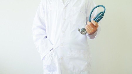 scientist in white coat on white wall.の写真素材