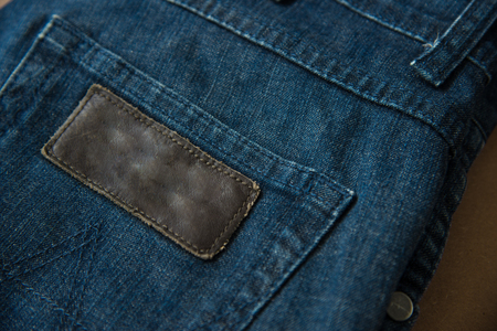 Jean and shoes men's fashion on wood texture.