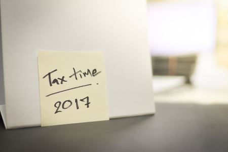 Tax time on white paper.の写真素材