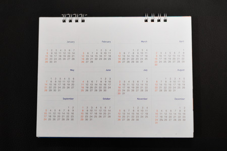 Close up white calendar on black background.の写真素材