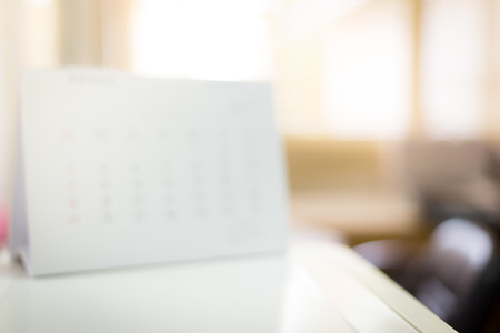 Blurred blank white calendar in office.の写真素材